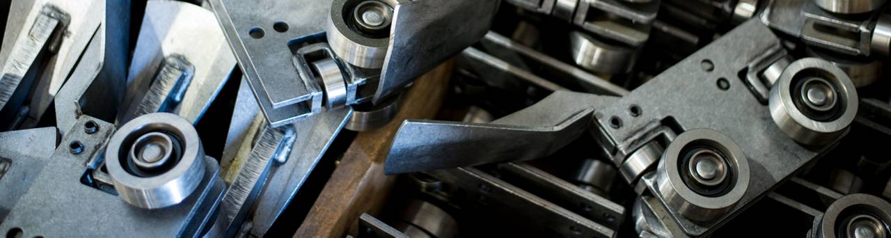 Metal forklift component assemblies with rollers, shown in Toyota parts photography