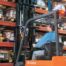 Toyota forklift operator moving through a warehouse